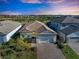 Two-story home with tile roof and brick driveway at 6043 Bluestar Ct, Bradenton, FL 34211