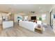 Open concept kitchen with white cabinets and granite countertops at 6043 Bluestar Ct, Bradenton, FL 34211