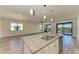 Kitchen island with granite countertop, double sink, and stainless steel dishwasher at 6043 Bluestar Ct, Bradenton, FL 34211