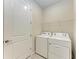 Practical laundry room with washer, dryer, and shelving at 6043 Bluestar Ct, Bradenton, FL 34211