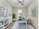 Home office with built-in shelving and a desk at 6043 Bluestar Ct, Bradenton, FL 34211