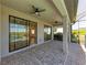 Covered patio with sliding doors and paver flooring at 6043 Bluestar Ct, Bradenton, FL 34211