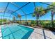 Relaxing screened pool with a tranquil water view at 6043 Bluestar Ct, Bradenton, FL 34211