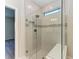 Large walk-in shower with glass enclosure and built-in seat at 6043 Bluestar Ct, Bradenton, FL 34211