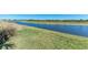 Peaceful backyard view of a canal and lush landscape at 6043 Bluestar Ct, Bradenton, FL 34211