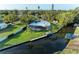 A waterfront property with a screened pool area and dock, perfect for enjoying the serene canal at 608 69Th W Ave, Bradenton, FL 34207