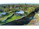 An aerial view of a home with a private dock and pool, situated on a canal at 608 69Th W Ave, Bradenton, FL 34207