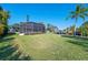 Large backyard with screened patio and canal views at 608 69Th W Ave, Bradenton, FL 34207