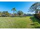 Spacious grassy backyard with scenic canal views at 608 69Th W Ave, Bradenton, FL 34207