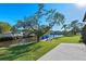 Peaceful backyard oasis with canal views and lush landscaping at 608 69Th W Ave, Bradenton, FL 34207