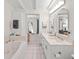 Elegant bathroom with double sinks, bathtub, and separate shower at 608 69Th W Ave, Bradenton, FL 34207