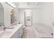 Spacious bathroom with double sinks, bathtub and shower at 608 69Th W Ave, Bradenton, FL 34207