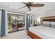 Main bedroom with sliding doors opening to the patio and pool area at 608 69Th W Ave, Bradenton, FL 34207