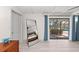 Bright bedroom with large mirror and sliding doors at 608 69Th W Ave, Bradenton, FL 34207