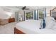 Bright bedroom with water view, king bed, and updated flooring at 608 69Th W Ave, Bradenton, FL 34207