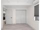 Empty bedroom with gray walls, doors, and wood-look flooring at 608 69Th W Ave, Bradenton, FL 34207
