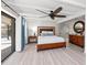 Comfortable bedroom with access to bathroom and a view at 608 69Th W Ave, Bradenton, FL 34207