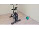 Bright exercise room with an air bike and exercise ball at 608 69Th W Ave, Bradenton, FL 34207