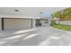 Modern garage with automatic door and ample parking space at 608 69Th W Ave, Bradenton, FL 34207