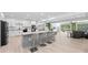 Modern kitchen with large island, stainless steel appliances, and open floor plan at 608 69Th W Ave, Bradenton, FL 34207