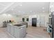 Modern kitchen with gray cabinets, granite countertops, and stainless steel appliances at 608 69Th W Ave, Bradenton, FL 34207
