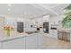 Updated kitchen with gray cabinets, granite countertops and stainless steel appliances at 608 69Th W Ave, Bradenton, FL 34207