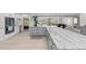 Modern kitchen with gray and white cabinets, granite countertops, and island at 608 69Th W Ave, Bradenton, FL 34207
