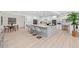 Modern kitchen with white cabinets, granite island, and breakfast bar at 608 69Th W Ave, Bradenton, FL 34207