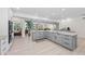 Modern kitchen features gray cabinets, granite countertops, and stainless steel appliances at 608 69Th W Ave, Bradenton, FL 34207