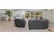 Living room with water view, comfortable seating, and access to a patio at 608 69Th W Ave, Bradenton, FL 34207