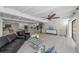 Bright living room showcases an open floor plan, modern furniture, and a view to the kitchen at 608 69Th W Ave, Bradenton, FL 34207
