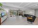 Spacious living area with water views, comfortable seating, and access to a patio at 608 69Th W Ave, Bradenton, FL 34207