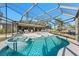 Spacious pool area with a screened enclosure and spa at 608 69Th W Ave, Bradenton, FL 34207