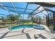 Inviting screened pool and spa with a relaxing view at 608 69Th W Ave, Bradenton, FL 34207