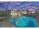 Luminous in-ground pool and spa with a covered patio at 608 69Th W Ave, Bradenton, FL 34207