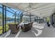 Screened pool and spa with patio furniture, offering relaxing water views at 608 69Th W Ave, Bradenton, FL 34207