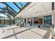 Enclosed pool and spa area with canal views and covered patio at 608 69Th W Ave, Bradenton, FL 34207