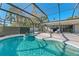 Relaxing pool and spa with screened patio and outdoor furniture at 608 69Th W Ave, Bradenton, FL 34207