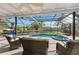Relaxing pool and spa area with canal views and covered patio at 608 69Th W Ave, Bradenton, FL 34207
