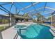 Enjoy this large pool and spa with screened enclosure and patio at 608 69Th W Ave, Bradenton, FL 34207