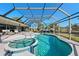Resort style pool and spa with screened enclosure and patio at 608 69Th W Ave, Bradenton, FL 34207