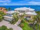 Luxury waterfront home with expansive bay views, private dock, and lush landscaping at 641 Key Royale Dr, Holmes Beach, FL 34217