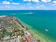 Aerial view of coastal town with beach and pier at 641 Key Royale Dr, Holmes Beach, FL 34217