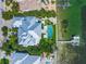 Bird's-eye view of a waterfront estate showcasing a large pool and private dock at 641 Key Royale Dr, Holmes Beach, FL 34217