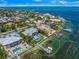 Wide aerial showcasing waterfront property, pool, and private dock at 641 Key Royale Dr, Holmes Beach, FL 34217