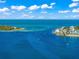 Aerial view of waterfront homes and calm water at 641 Key Royale Dr, Holmes Beach, FL 34217