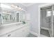 Elegant bathroom with a double vanity and large mirror at 641 Key Royale Dr, Holmes Beach, FL 34217