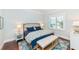 Spacious bedroom with a king-size bed and hardwood floors at 641 Key Royale Dr, Holmes Beach, FL 34217