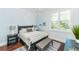 Charming bedroom with a queen-size bed and hardwood floors at 641 Key Royale Dr, Holmes Beach, FL 34217