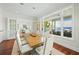 Bright dining room with hardwood floors and water views at 641 Key Royale Dr, Holmes Beach, FL 34217